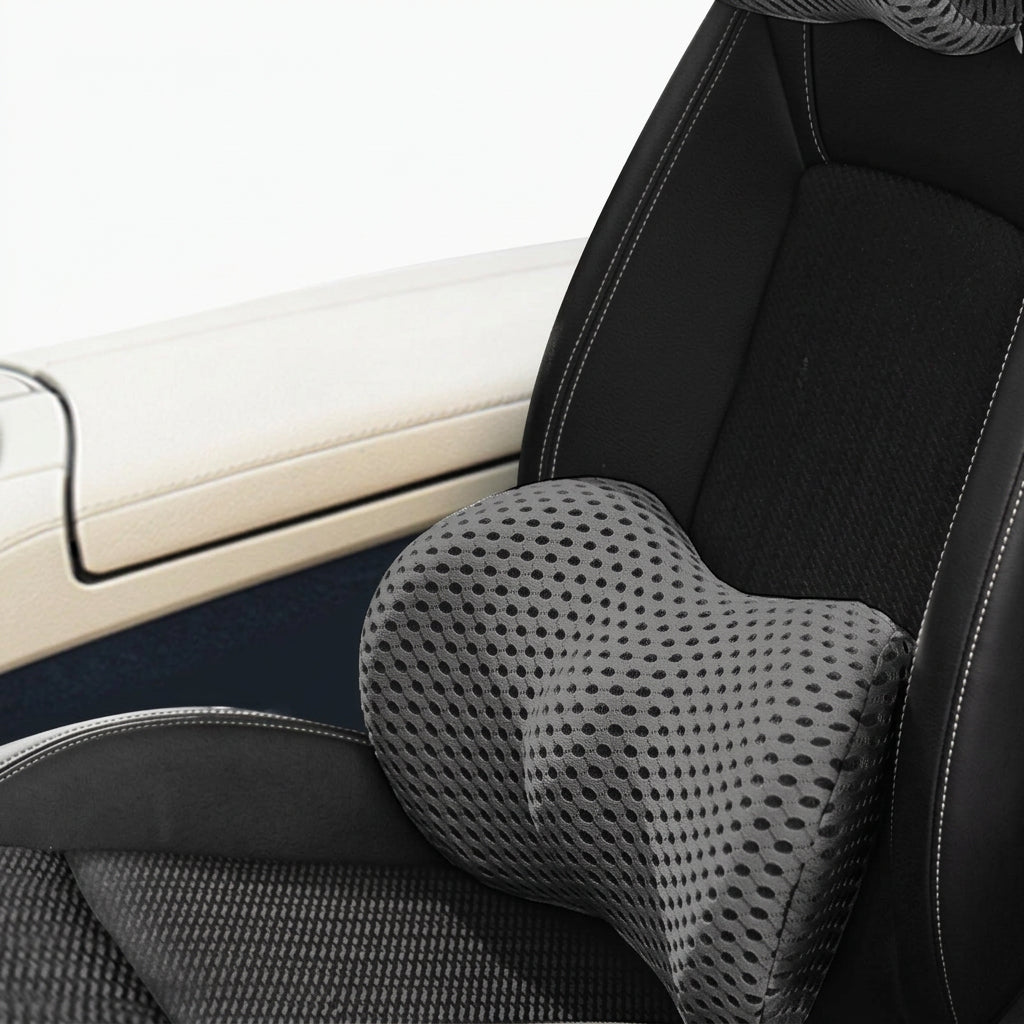 Matching car headrest and lumbar support cushions with stitched upholstery for a coordinated vehicle interior.