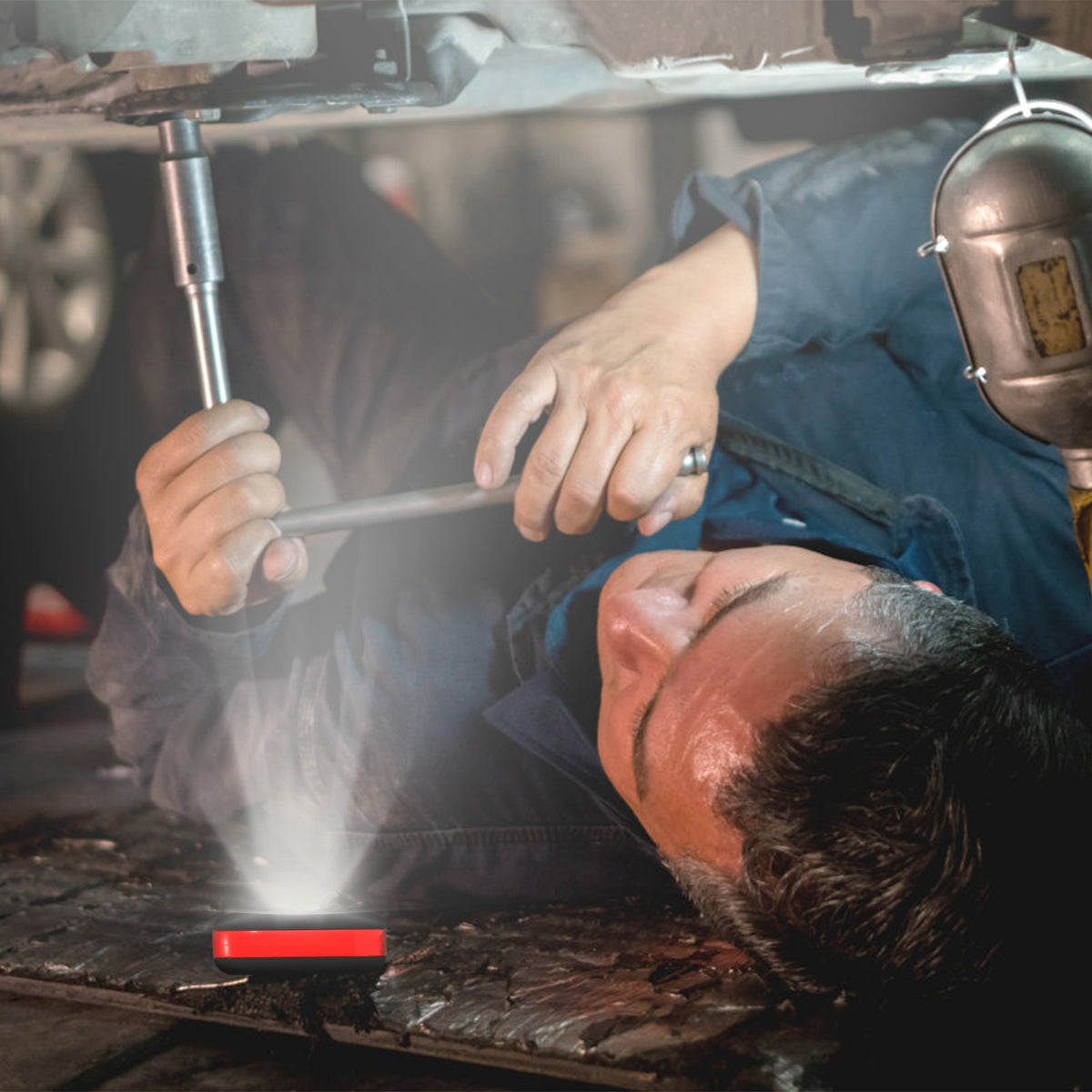 Portable battery-powered LED work light with 27 LEDs and two lighting modes for home safety, emergency supplies, and temporary lighting during power outages.
