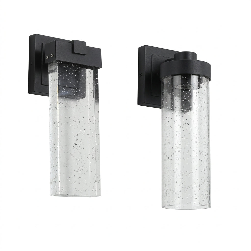 Set of two black outdoor wall lights with slim vertical designs and clear decorative crystal-bubble shades.
