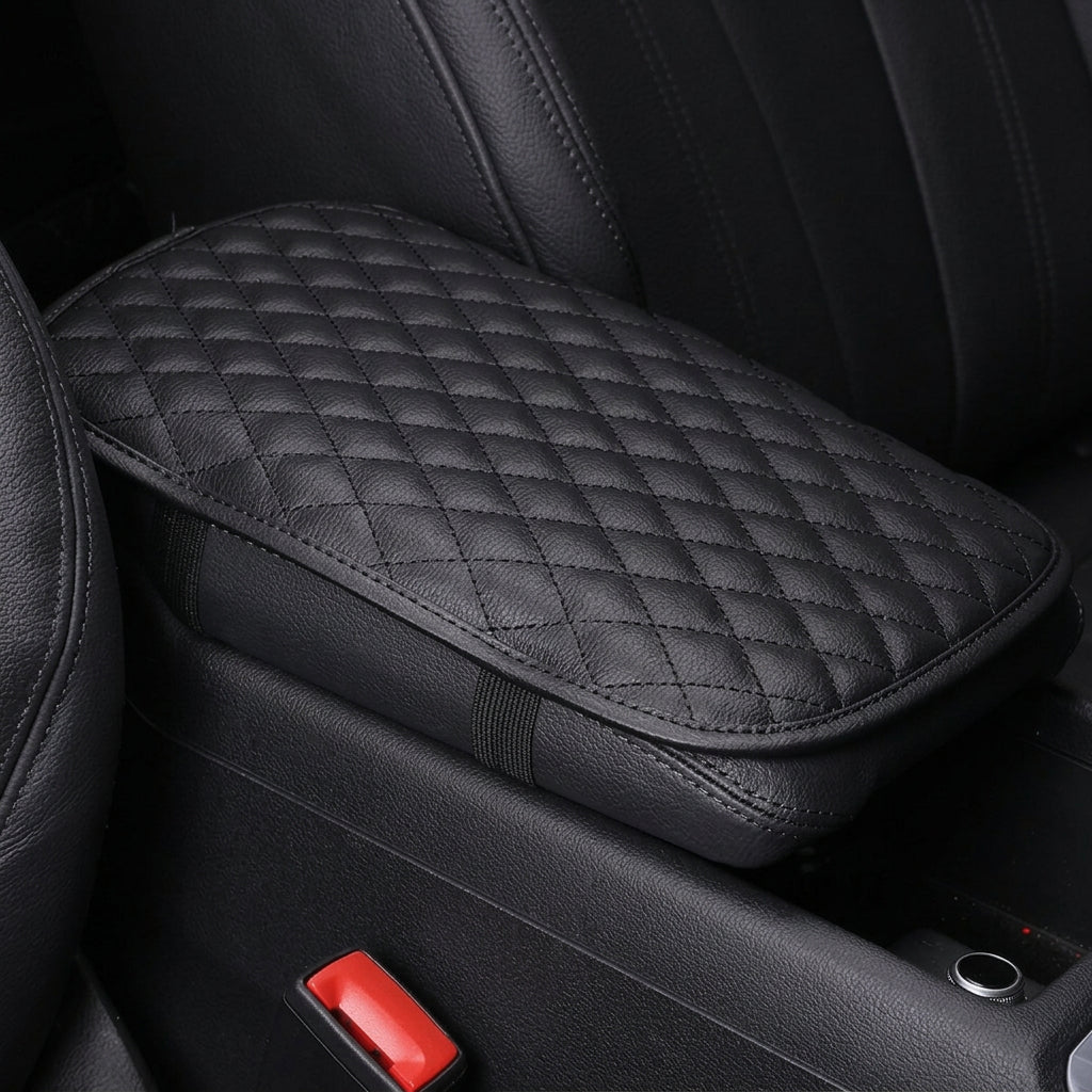 Padded black car center console armrest cover designed to provide extra elbow cushioning during daily drives.